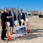 eter Guzman of the Latin Chamber of Commerce speaks to the attendees alongside Todd Nigro and Michael Nigro of Nigro Construction during a ground breaking ceremony