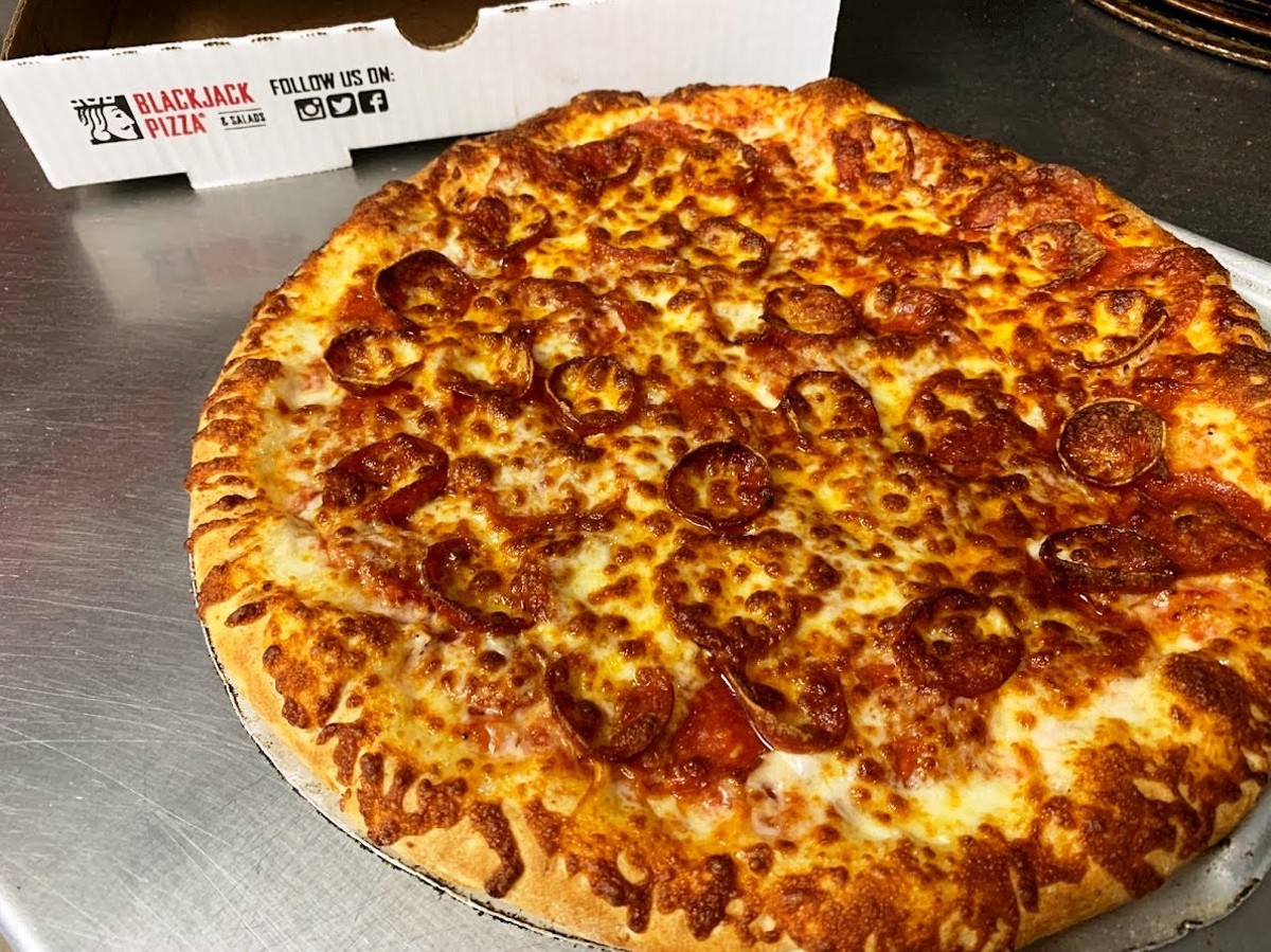 An original, hand-tossed Blackjack Pizza.