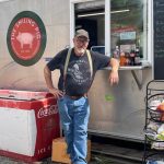 The Smiling Pig owner Tim Gregg outside of his food truck in Bailey.