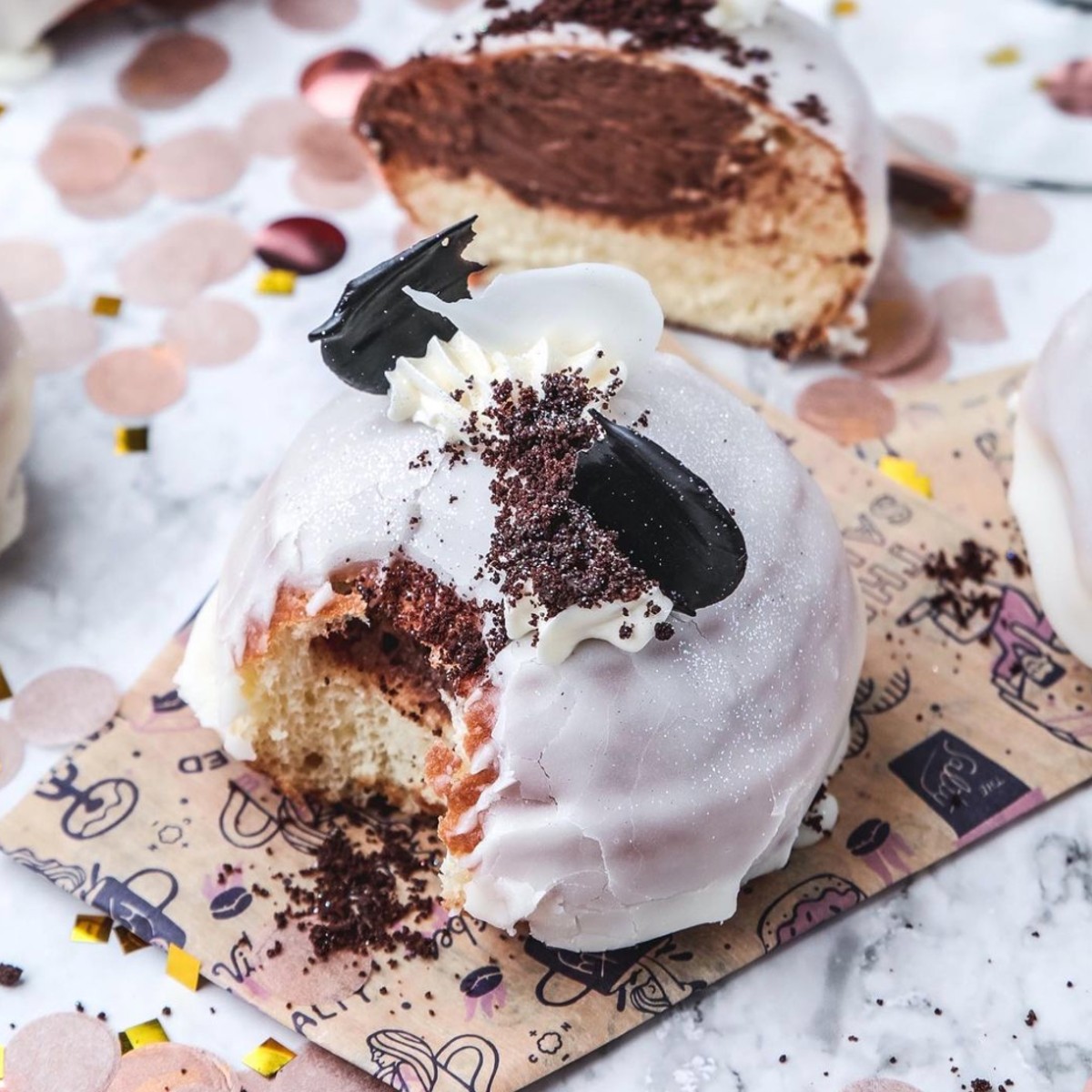 A black and white NYE donut from The Salty Donut.