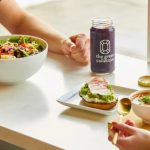 The Green Collective eatery bowls, toasts and smoothies at a customer table.