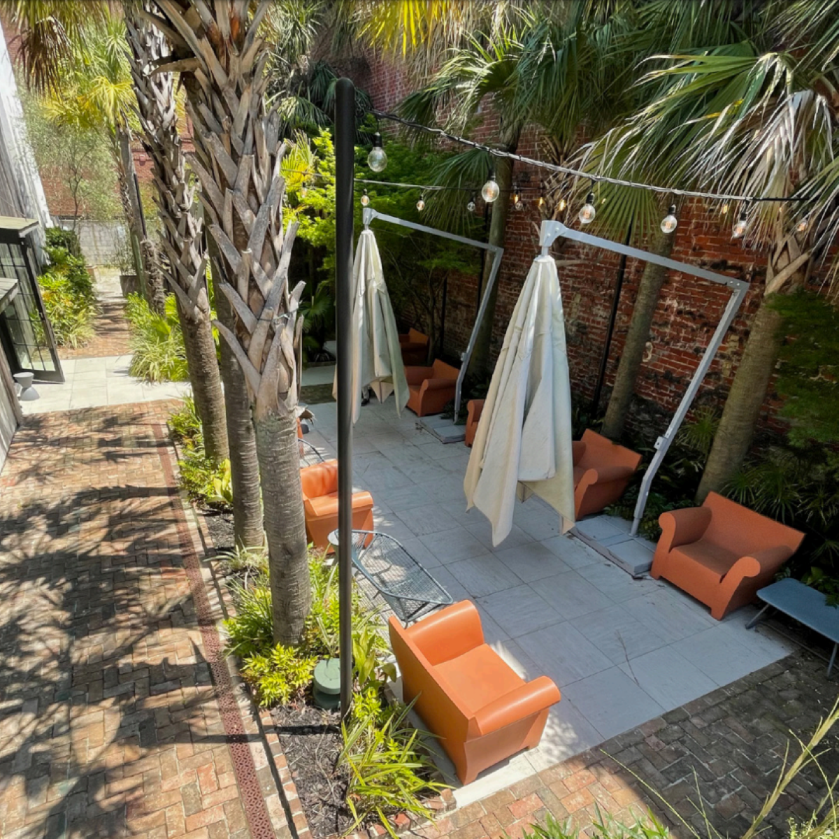 an outdoor patio at 492 king street in charleston south carolina which will be renovated for a new pasta beach restaurant