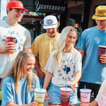 A group of young people wearing HTeaO merchandise and drinking iced teas which will be sold at the new Charleston location soon