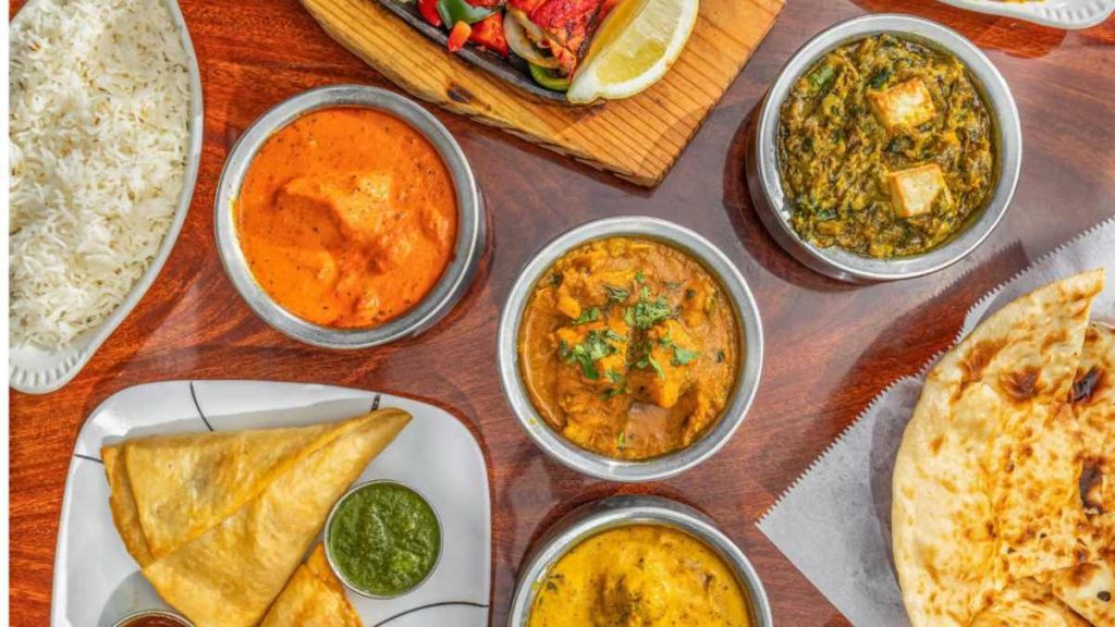 The Indian chefs prepare curries, crispy tandoori items, and Nepali momos. Other menu highlights at India Village are palak paneer, pakoras, lamb tikka masala, gulab jamun, etc.