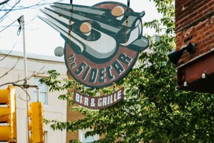 Health inspectors observed no handwashing signage at the warewashing area sink to remind food employees to wash their hands.