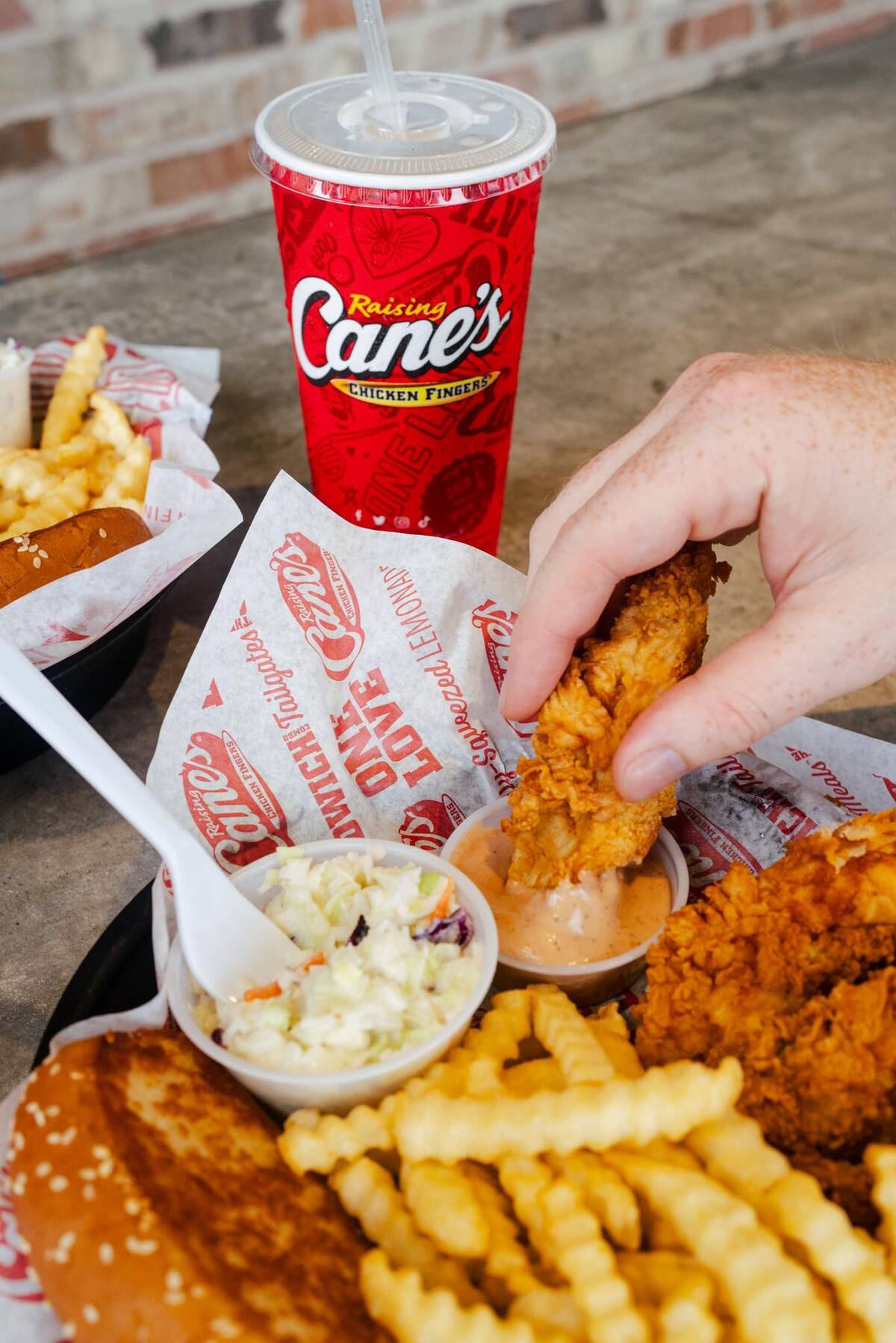 Raising Cane's to Pop Up and Start Dishing Out Crispy Strips on Great Hills Trail