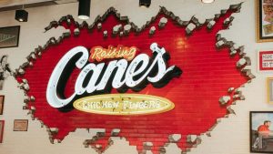 This image shows Raising Cane's brick sign.