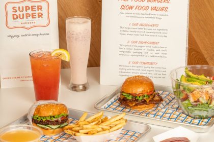 The menu also offers classic sides like crispy fries and garlic fries topped with fresh garlic and aged cheddar.