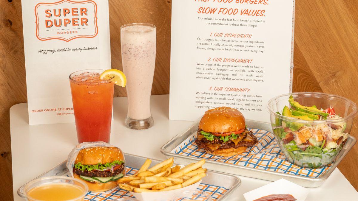 The menu also offers classic sides like crispy fries and garlic fries topped with fresh garlic and aged cheddar.