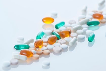 The Woburn-based biotech company cited a regulatory setback tied to its advanced skin cancer therapy as the reason for the layoffs.