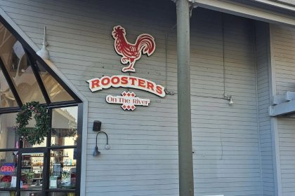 Roosters on the River front image