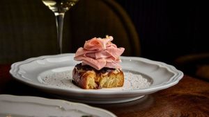 Designed as a neighborhood gathering place, Alla Vita combines Italian classics, locally sourced produce, and flexible event spaces.
