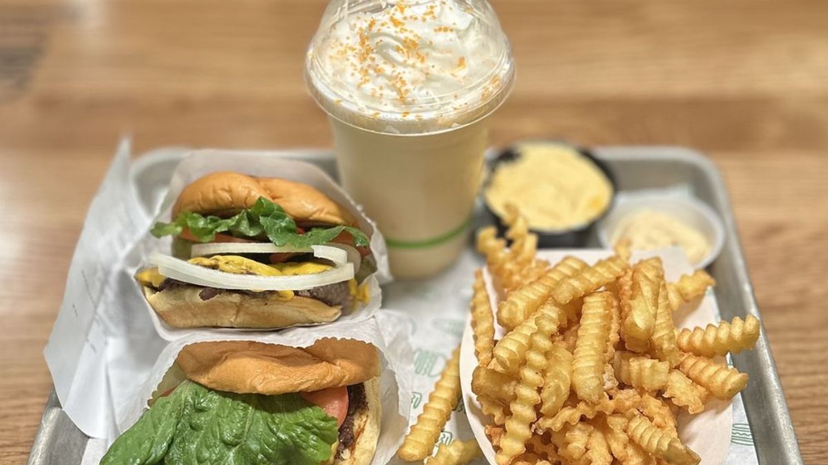 Shake Shack Image of Shack Burgers, fries, and dreamsicle shake from the menu of Shake Shack (Danny B. | Yelp)