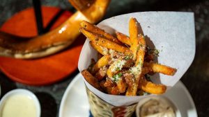 Image of Fresh Cut Truffle Fries served at Uptown Sporting Club (Abante Photography)